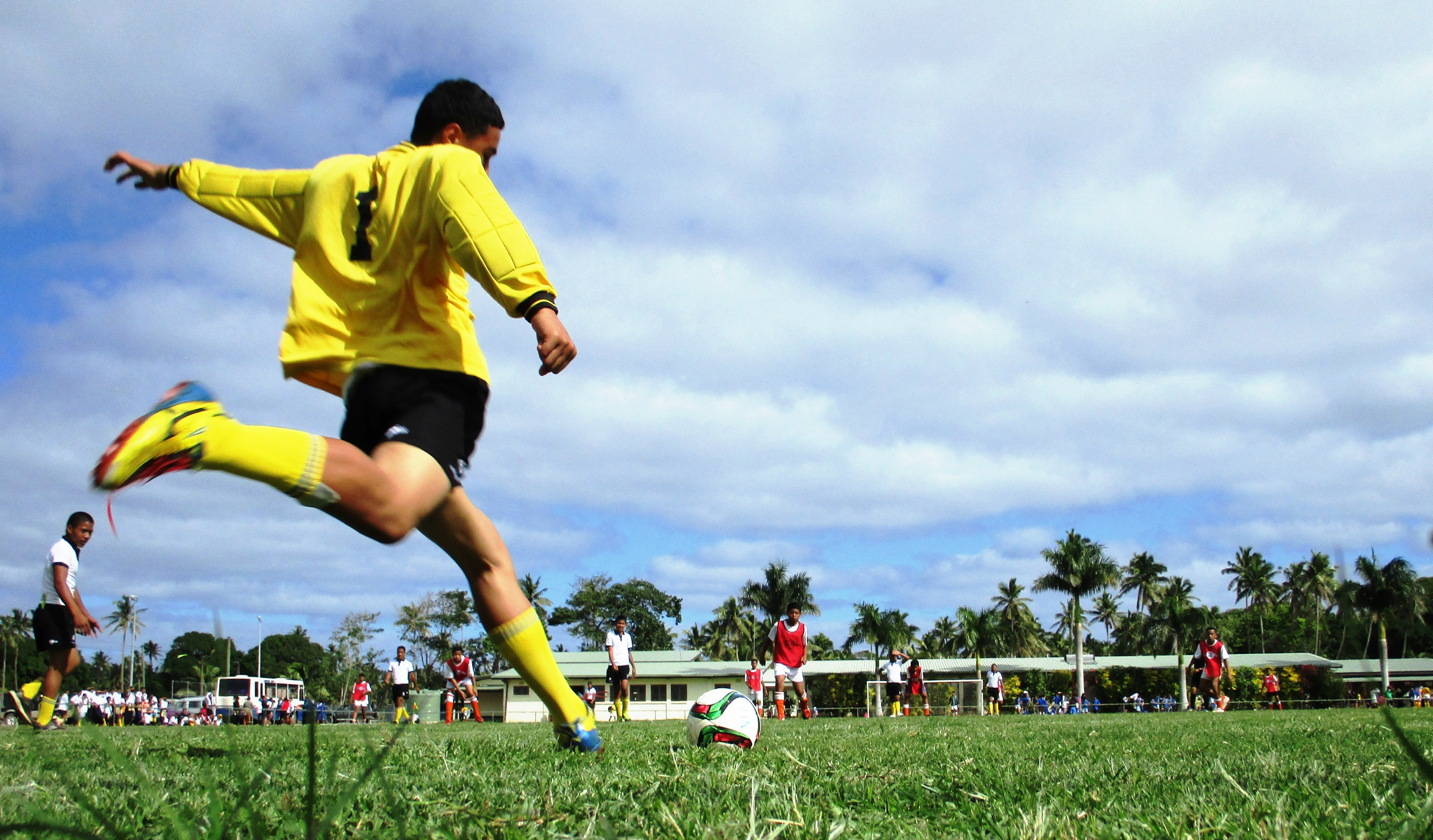 Boys playing football in Fiji